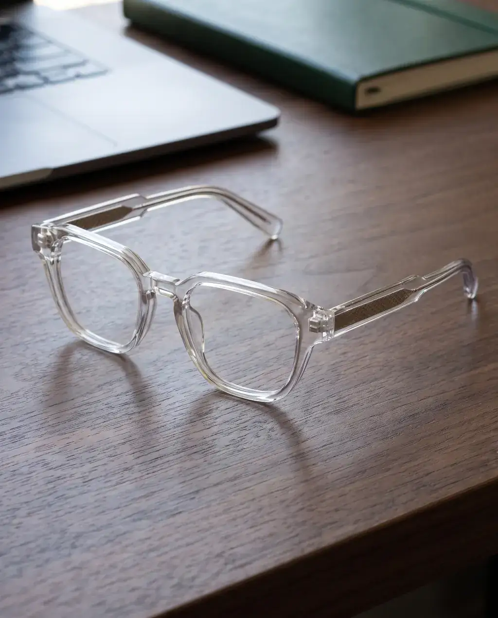 Origo Clear lens, transparent frame — on a desk