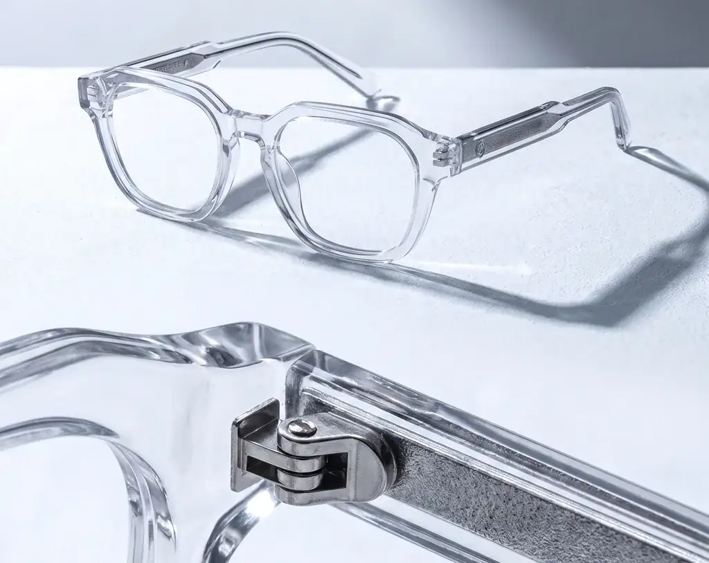 The clear frame, and the hinge with the metal temple inlay up close