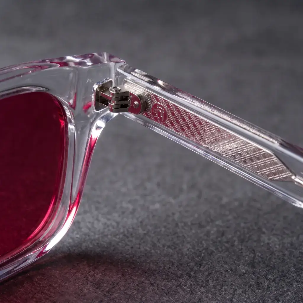 Origo Red lens, transparent frame — the hinge and the temple inlay