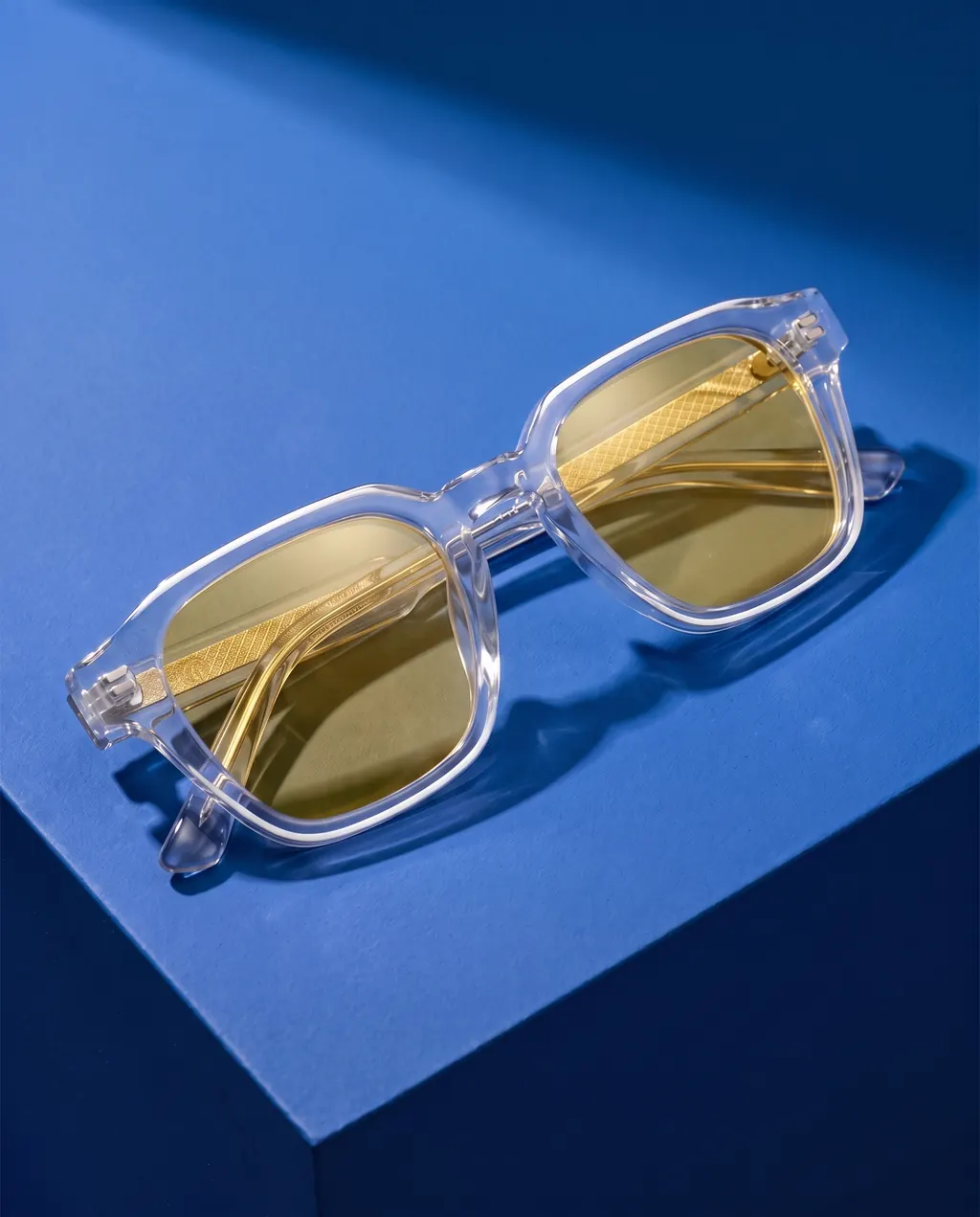 Origo Yellow lens, transparent frame — on blue