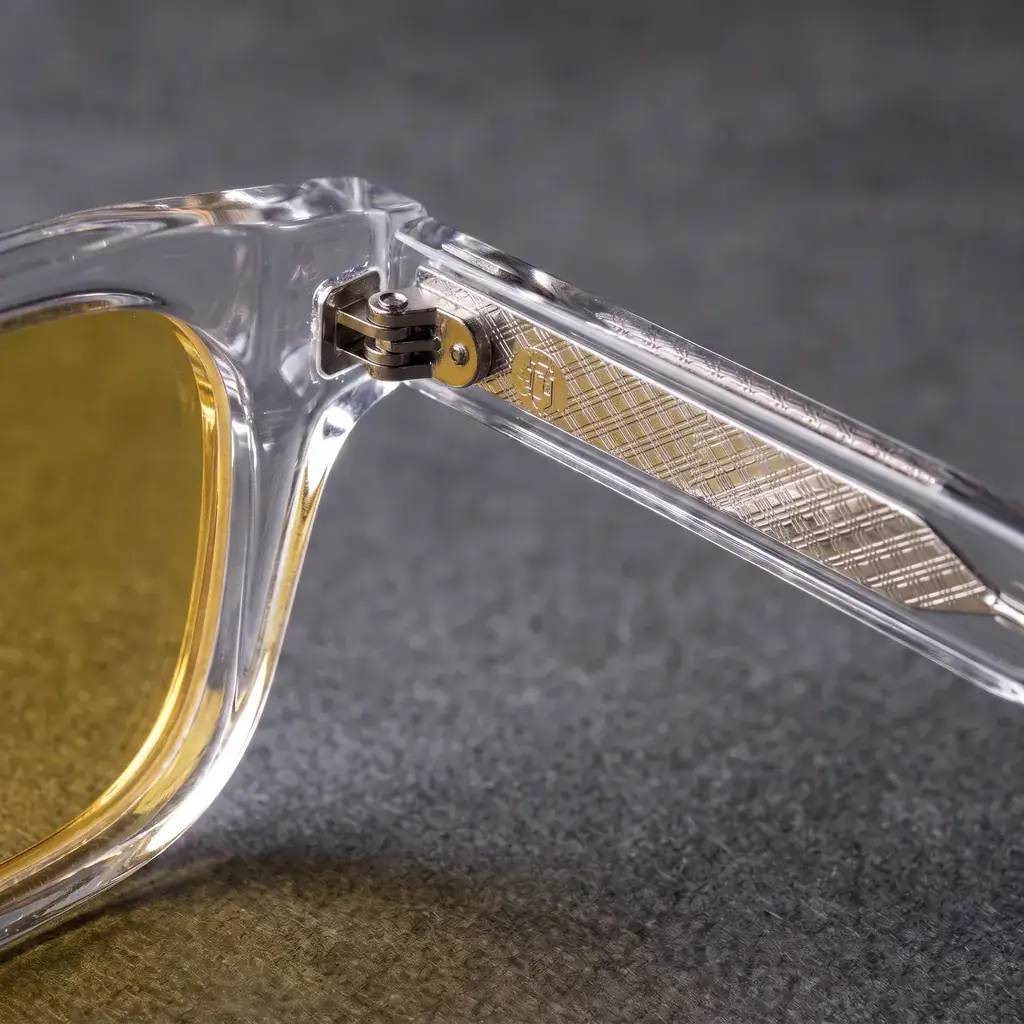 Origo Yellow lens, transparent frame — the hinge and the temple inlay